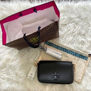 Black Thea mini bag with tassels and black/gold chain. Includes duster bag.